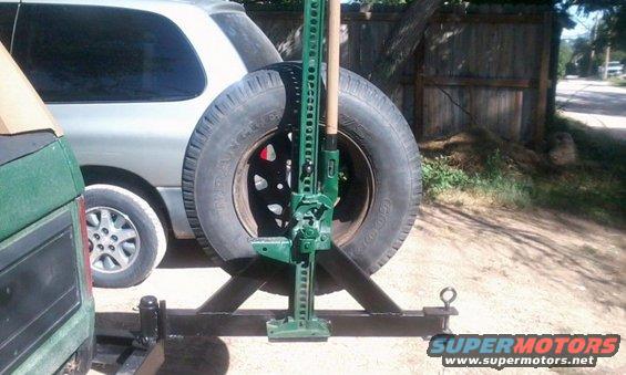 bumper_18.jpg Mounting location for my hi-lift jack.  It sits on a plate behind the spare and bolts to the tire carrier with a wingnut.