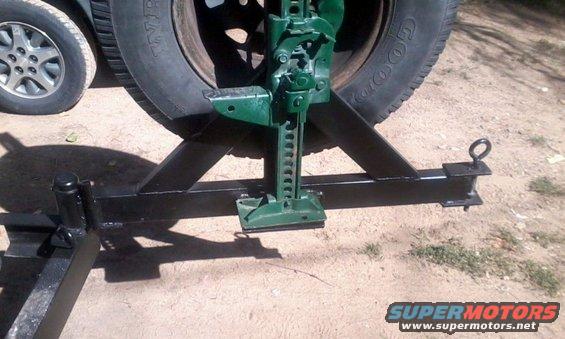 bumper_19.jpg The hinge is a glorified trailer wheel bearing from comp4x4.com.  Opens smoothly and is very strong.  Since the spindle fits inside the bumper in its own sleeve, you don't actually weld to the spindle at all, saving it from heat stress.  The locking pin is an eyebolt, a compression spring, a washer and a nylock nut.  The springe forces the eye-bolt downwards into a matching hole in the bumper.  It's not going to come out on its own.