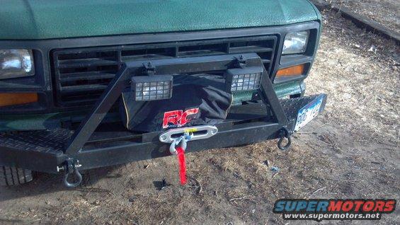 Winch is protected from the elements. I'm going to revamp that grill guard so it's more rectangular than trapezoidal. And put the light tabs facing the right direction