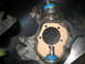 1996 Ford Bronco - Close-up of a vehicle's front suspension knuckle and ball joint assembly.