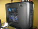 1987 Polaris Indy 600 - A black computer tower with a mesh side panel showing internal components and blue LED fans.