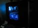 1987 Polaris Indy 600 - A computer tower with glowing blue fans and internal components is visible in the dark.