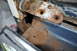 1986 Ford Bronco - Close-up of rusted metal components and a chrome bumper, with a watermark for SuperMotors.net visible.