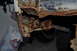 1986 Ford Bronco - Close-up view of severely corroded vehicle chassis components, showing extensive rust damage.