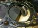 1993 Nissan Altima - Close-up of a used engine head gasket showing significant carbon deposits and damage.