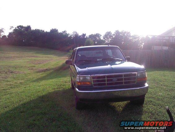 Green 1996 Ford Bronco front view parked on grass