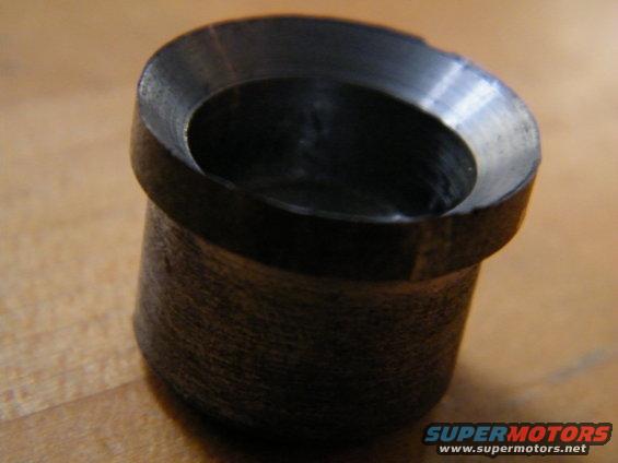 close-up of a metal bushing with a beveled edge