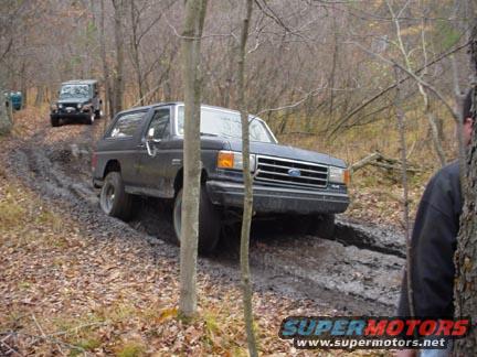 Here I am making my first pass through the first mud hole. Wasn't bad, hit hard going in, made it through just fine.....bigger trucks were yet too come.......