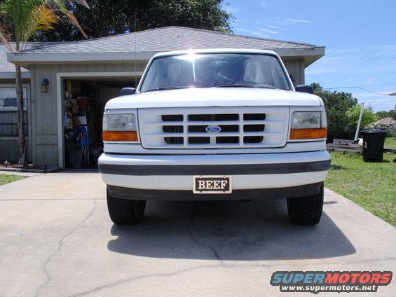 Front view of a white 1995 Ford Bronco parked in a driveway