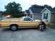 1972 Ford Ranchero - A man and a young child pose next to a yellow Ford Ranchero parked in a driveway.