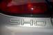 1998 Ford Taurus - Close-up of the rear badging and taillight assembly on a silver Ford Taurus SHO.