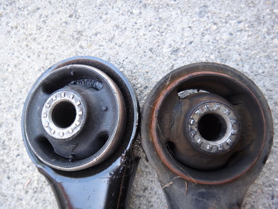 comparison of a new and worn suspension control arm bushing