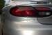 1998 Ford Taurus - Rear view of a silver 1998 Ford Taurus SHO, its unique taillight design and prominent badging.