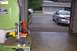 1998 Ford Taurus - A silver sedan is parked in a driveway next to a white pickup truck, seen from inside a garage.