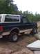1992 Ford Bronco - This 1992 Ford Bronco is navigating an off-road course, with its tires positioned over large rocks.