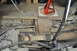 1986 Ford Bronco - Undercarriage view shows extensive rust on the frame and drivetrain components.