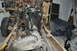 1986 Ford Bronco - Vehicle chassis undergoing teardown, with engine and transmission components visible. The registry claims it is a 1986 Ford Bronco.