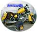 1976 Yamaha Virago - A yellow motorcycle with custom saddlebags is parked in front of a garage door. A black bag sits on the ground in front of the motorcycle.