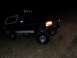1992 Ford Bronco - This 1992 Ford Bronco is equipped with off-road lights and appears to be navigating rough terrain in the dark.