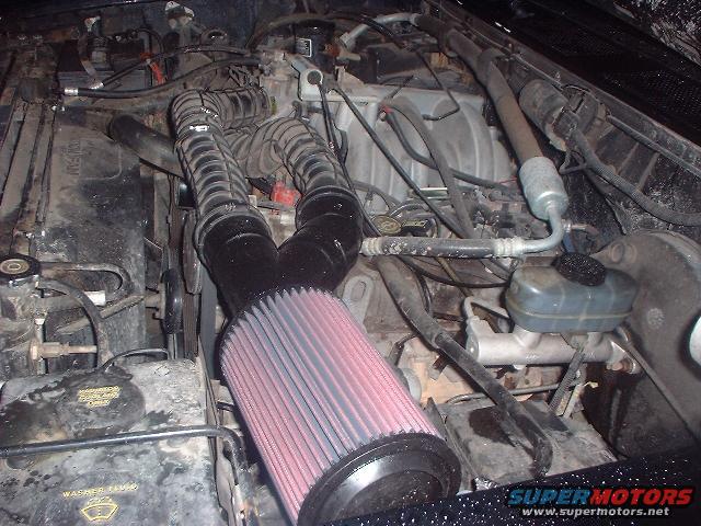 1993 Ford Bronco engine bay with aftermarket air filter and hoses