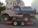 1992 Ford Bronco - A muddy 1992 Ford Bronco is loaded onto a U-Haul trailer.