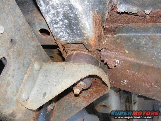 Rusted frame and suspension parts with a visible '9' marking