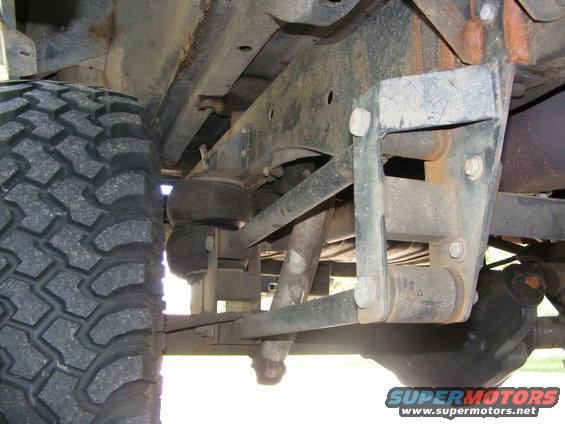 Undercarriage view showing air suspension bags and linkage on a vehicle