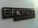 1992 Ford Bronco - Close-up of a Bronco Custom emblem, indicating a specific trim level.