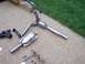 1992 Ford Bronco - Exhaust system components, including catalytic converters and pipes, are displayed on a paved surface.