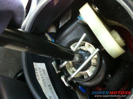 img_3525.jpg This is how the neutral safety switch I made works.  The shifter completes the circuit for the neutral safety ground input.  The springs are isolated from ground (mounted to plastic), but tied to wires.  The ground originates from the parking brake switch, so it must be activated inorder to remote start the car.  This photo shows the shifter in 1st (or Rev), and the circuit is open, rendering the Remote start disabled. 