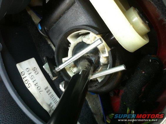 This is how the neutral safety switch I made works.  The shifter completes the circuit for the neutral safety ground input.  The springs are isolated from ground (mounted to plastic), but tied to wires.  The ground originates from the parking brake switch, so it must be activated inorder to remote start the car.  This photo shows the shifter in 2nd and the circuit is open, rendering the Remote start disabled. 
  

