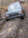 1989 Ford Bronco - Here I am stuck. This was my second pass through the hole. Had to use the snatch block on me and strap the jeep that was winching me to a t…