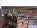 1968 Mercury Cougar - The interior of a 1968 Mercury Cougar shows its dashboard with wood grain accents and various controls.