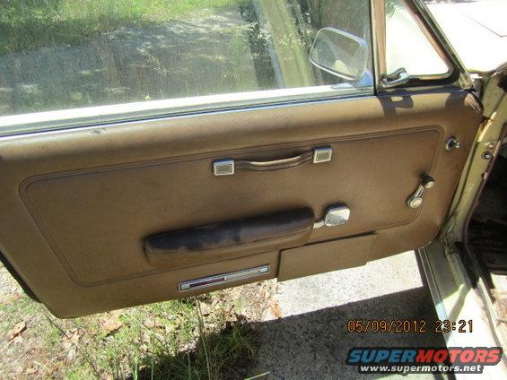 1968 Mercury Cougar interior door panel with brown upholstery and chrome accents