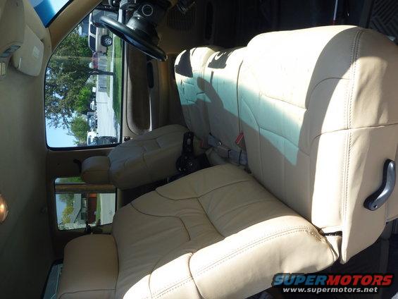 Passenger seat done, burlap on springs.