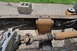1986 Ford Bronco - Close-up view of the undercarriage of a vehicle, showing drivetrain components and frame.