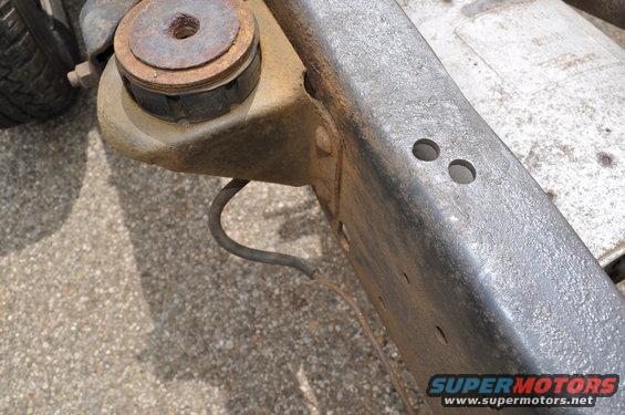 Frame and suspension part with rubber isolator