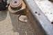 1986 Ford Bronco - Close-up of a vehicle's frame and suspension component, showing a rubber isolator and rusty metal.