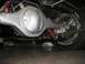 1964 Ford Fairlane - Close-up of a vehicle's rear axle assembly, suspension, and tire.