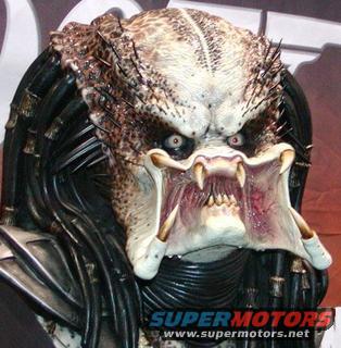 Predator mask with intricate details and visible teeth