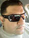 2012 Ford Bronco - A close-up shot of a man wearing sunglasses, taken from inside a vehicle.