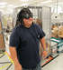 2012 Ford Bronco - A person poses in a warehouse setting, sporting a unique hat with goggles and faux dreadlocks.