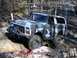1979 Ford Bronco - Camouflaged Ford Bronco navigates a challenging off-road course.