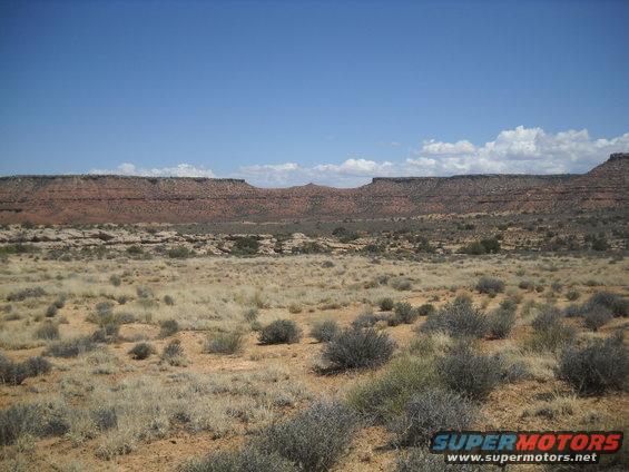 Desert landscape with mesas under a blue sky
