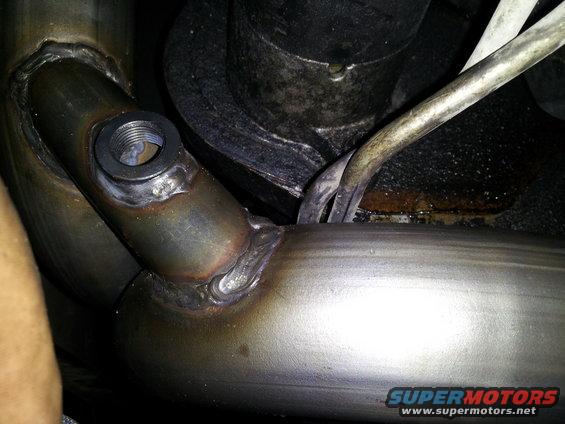 transmison lines resting ontop of y pipe, and this isnt even when the y pipe is completely bolted on, so when it is, the tranny lines will be pressed against the pipe even more