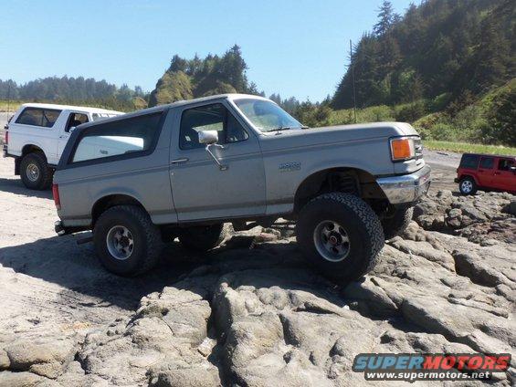 Gray 1988 Ford Bronco on rocks