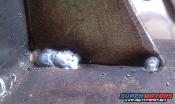 Close-up of metal parts joined by welds