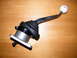 2004 Ford Crown Victoria - A Hurst shifter assembly with a white shift knob is shown on a wooden surface.