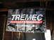 2004 Ford Crown Victoria - A banner for TREMEC TRANSMISSIONS hangs from a wooden ceiling.