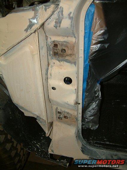 1983 Ford Bronco door jamb with body filler and blue tape